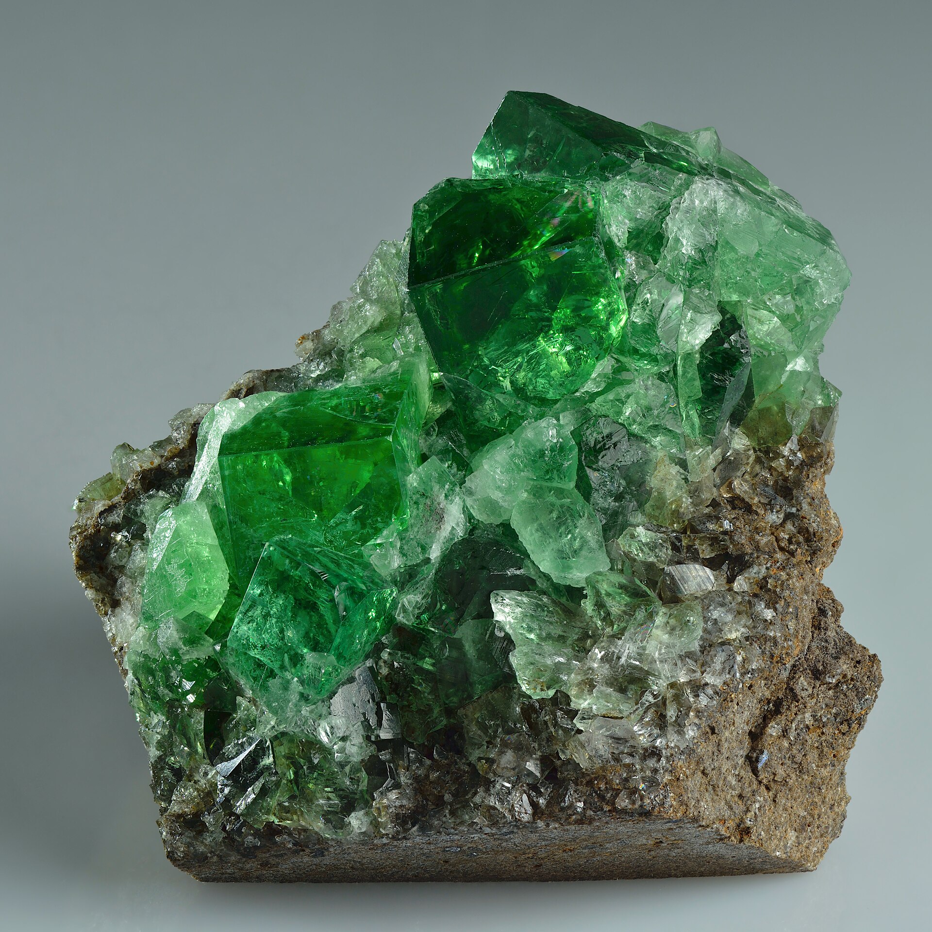 Fluorite mineral specimen — Green fluorite twinned crystals up to 18 mm in size on matrix (5.4 × 5 × 3.7 cm). Found from Diana M