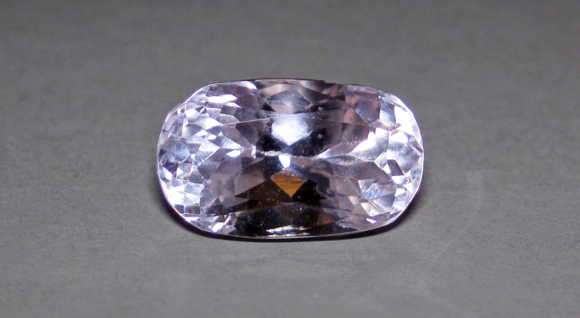 Kunzite crystal mineral specimen — (~1.2 centimeter across) A mineral is a naturally-occurring, solid, inorganic, crystalline substance