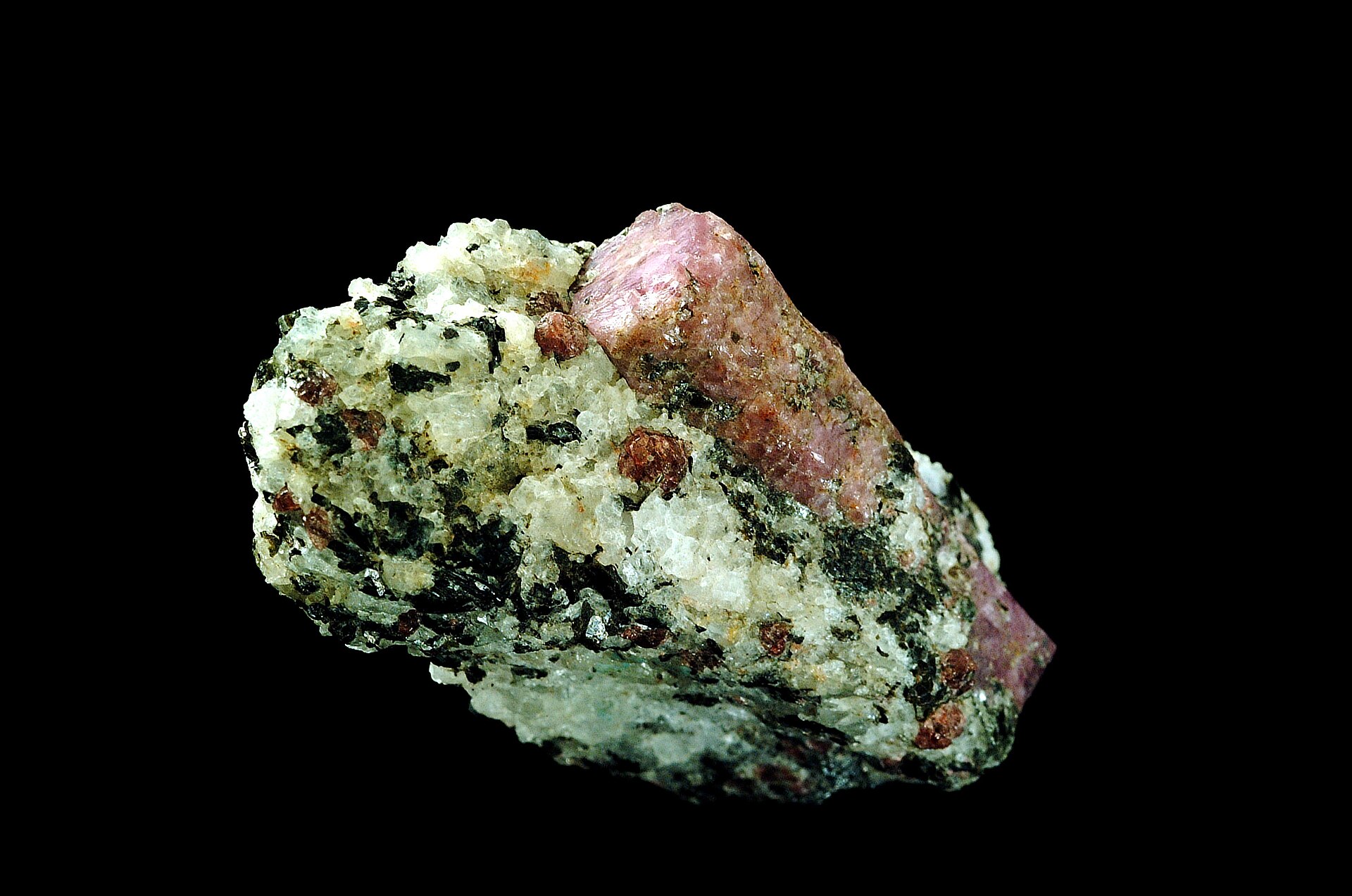 Ruby gemstone mineral specimen — Corundum, Al2O3, comes in many colors. Sometimes it is gemmy and has value as a gemstone (ruby or sa