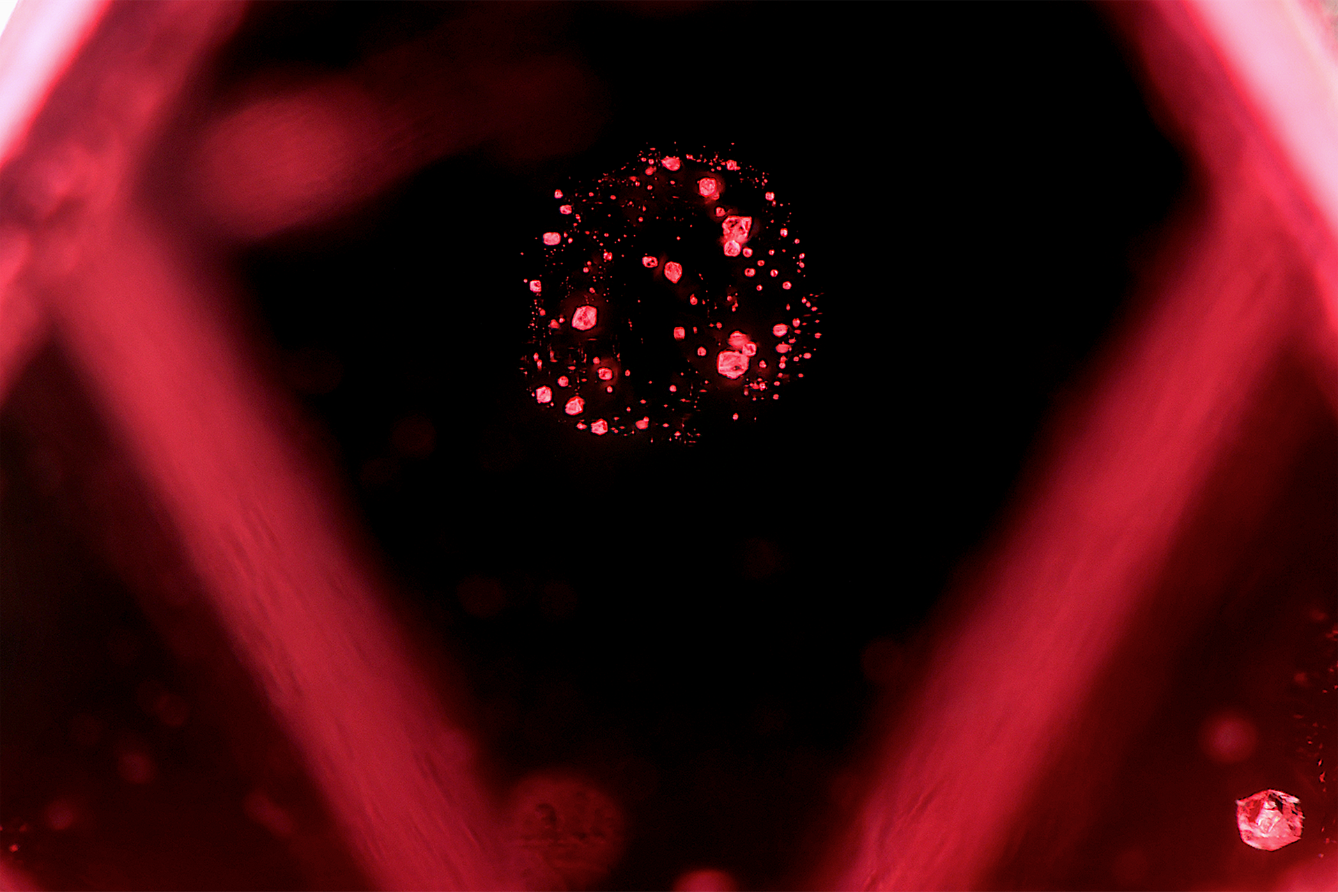Spinel gemstone mineral specimen — Spherical concentration of crystals in a gem spinel