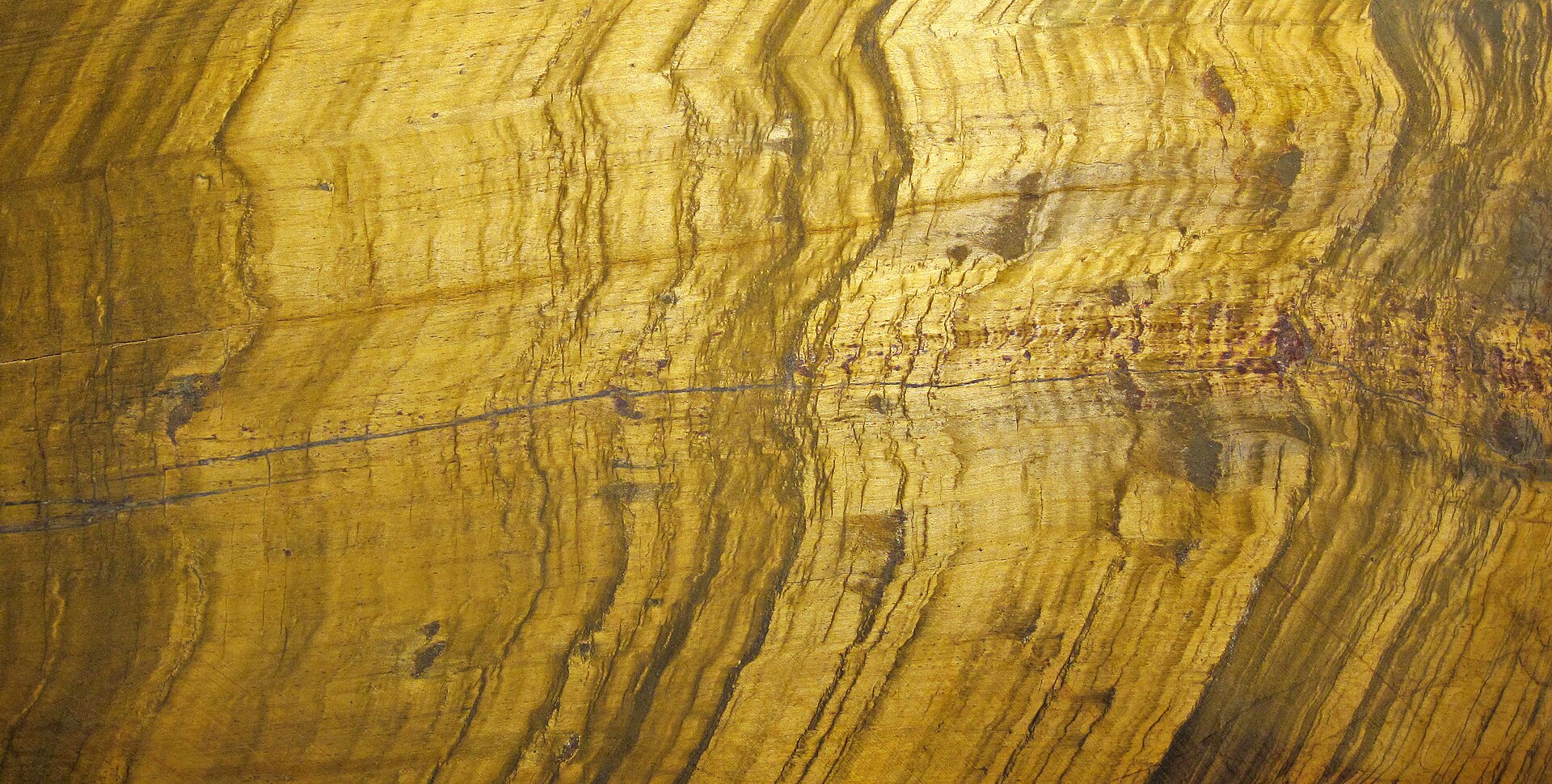 Tiger eye mineral specimen — Tiger's eye quartz (cut surface) A mineral is a naturally-occurring, solid, inorganic, crystalline s