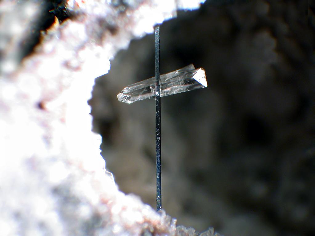 Topaz crystal mineral specimen — A long thin Pseudobrookite (2 mm) glued together with Topaz crystals - Locality: Wannenköpfe, Ochten
